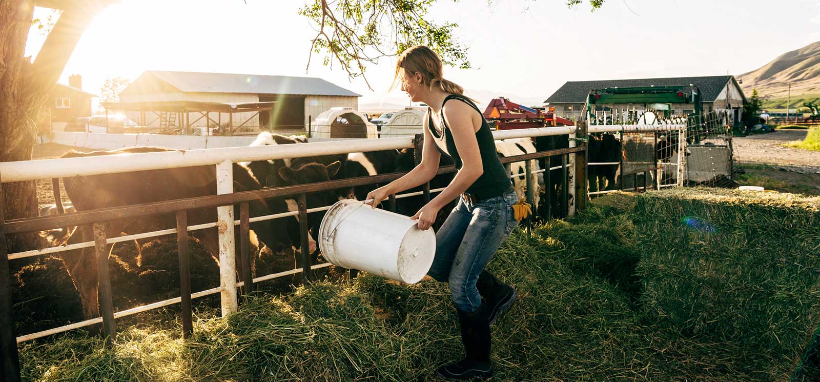 Lady working on a farm for the Heifer Program
