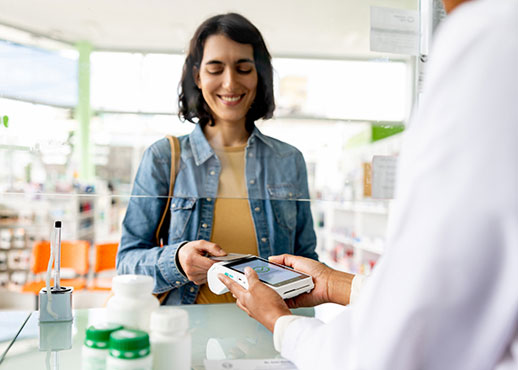 A lady buying medicine in a pharmacy